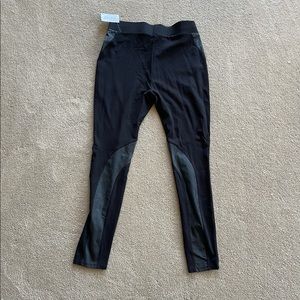 Tights with pleather detailings.